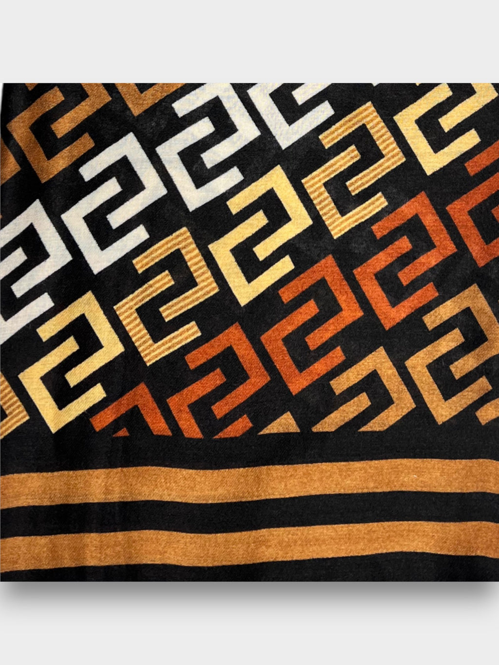 C pattern on printed scarf